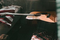 Aesthetic acoustic guitar in a van, boho road trip photo