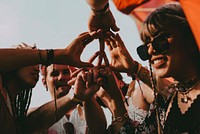 Friends joining hands, music festival aesthetic, summer vacation photo