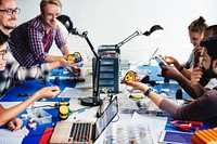 Electrical technicians working on robot electronics parts