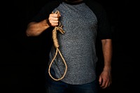 Hand holding loop rob with black background