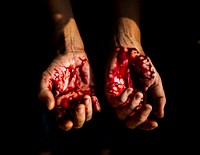 Bloody hands with black background