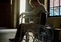 Alcoholic man sitting in a wheelchair