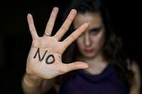 Closeup of woman hand written with no word on palm