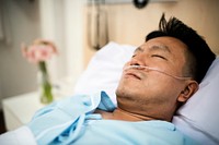 A sick Asian man in the hospital