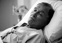 A sick elderly is staying at the hospital