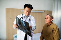 Doctor with patient x-ray film