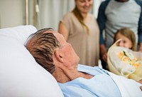 A sick elderly is staying at the hospital
