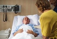 Friends visiting a sick patient at a hospital