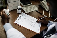 A doctor writing a prescription