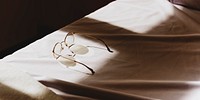 Eyeglasses on the bed