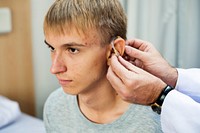 Young man with hearing aid