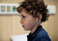 Young boy with hearing aid