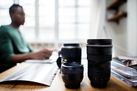 Photographer and group of lens on the table