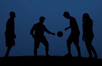 Silhouette of friends playing with a ball