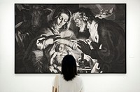 Girl looking at a painting in a gallery