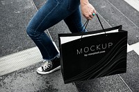 Woman carrying a shopping bag mockup
