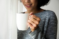 Woman holding  coffee cup