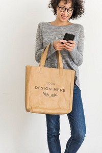 Woman holding design space leather tote bag