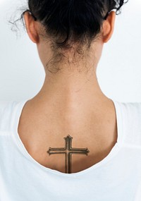 Back view portrait of a woman with a cross tattoo