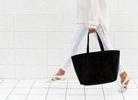 Woman with black tote bag