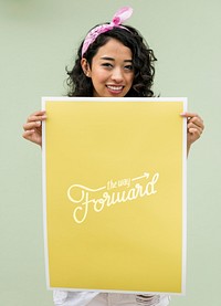 An Asian woman holding motivation paper board