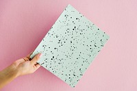 Hand holding dots paper