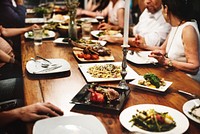 Group of diverse friends are having a dinner together