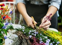 Woman arranging flowers at the desk