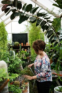 Woman working in a garden shop
