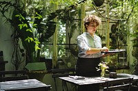 Woman working in a gardening shop