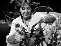 Woman arranging flowers in the garden