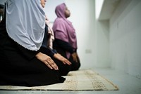Female Muslims praying on the praying carpet