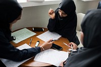 diverse muslim girls studying in classroom