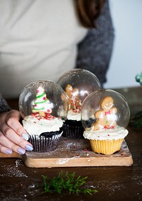 Set of Christmas cupcake snow globes