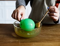 Woman preparing a gelatin globe
