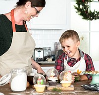 Mother and son baking before Christmas