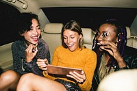 Diverse women in a backseat of a cab