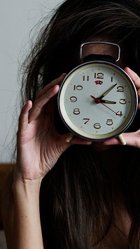 Messy hair girl wakes up with a clock mobile phone wallpaper