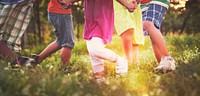 Cute diverse kids dancing in the park