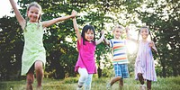 Cute diverse kids playing in the park