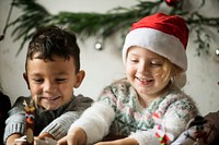 Two kids playing together on Christmas