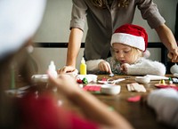 Kids at a table doing Christmas arts and crafts
