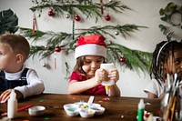 Kids at a table doing Christmas arts and crafts