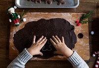 Kid making Christmas cookies