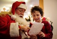 Santa Claus and kid in a house