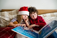 A Caucasian siblings enjoying Christmas holiday