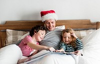 A father telling a Christmas story to his kids