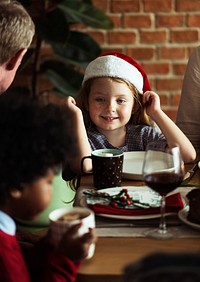 Cheerful caucasian girl wearing a Santa hat