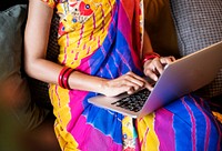 Indian woman is using computer laptop