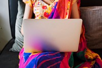 Indian woman is using computer laptop